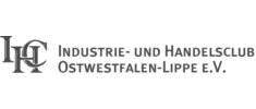 Logo von IHC mit stilisiertem Schriftzug in grauer Farbgebung.